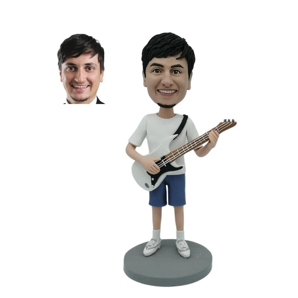 Customized bobblehead of a man playing guitar